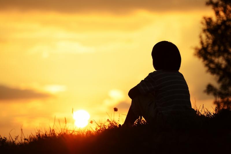 Little boy at sunset